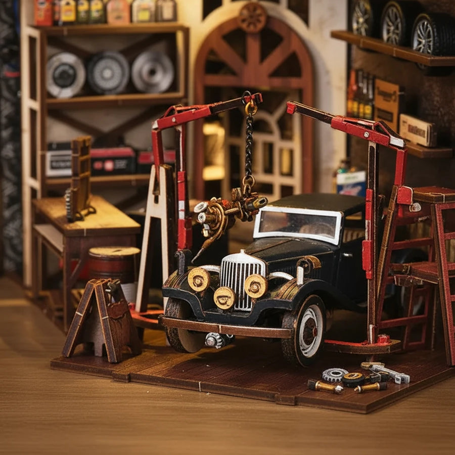 Craftsmanship Repair Shop DIY book nook ground floor close-up – black vintage car under red hydraulic lift with chain hoist, miniature gears and engine parts, tool shelves with tires and oil cans in background, warm amber workshop lighting