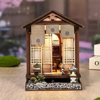 【Moss-Lantern Harmony Garden】 DIY kit unboxed contents: laser-cut wooden sheets, LED light wire set, translucent shoji paper, illustrated manual, and assembly tools