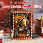 【Snow Realm Wei Pavilion】 Immersive assembly process display: hands holding the teal wooden wall part with arched window and Christmas stocking hooks, experiencing the crafting fun of mortise-and-tenon assembly, immersed in the festive atmosphere