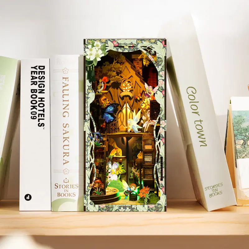【Secret World of the Forest】 book nook sandwiched between white books, wooden frame and embossed vine decorations blending perfectly into a modern bookshelf, revealing fairies and stairs under yellow light through the cutout opening, quiet and cozy