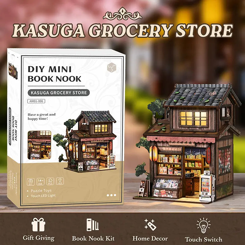 【Kasuga Grocery Store】 DIY miniature model fully assembled, showing front two-story pitched roof, dark gray tile texture, openable sliding doors with lattice windows, and red lanterns on lintel