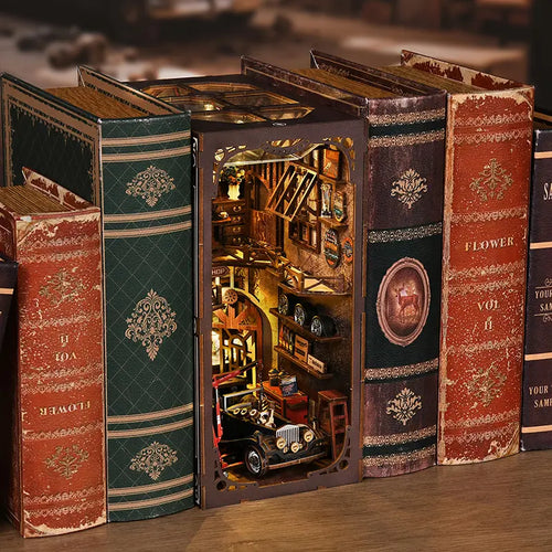 Close-up of first-floor repair area inside【Craftsmanship Repair Shop】： red hydraulic lift holding miniature vintage car chassis, tool racks lined with mini wrenches and screwdrivers, oil drums and toolboxes scattered on floor, authentic early 20th-century auto repair roughness