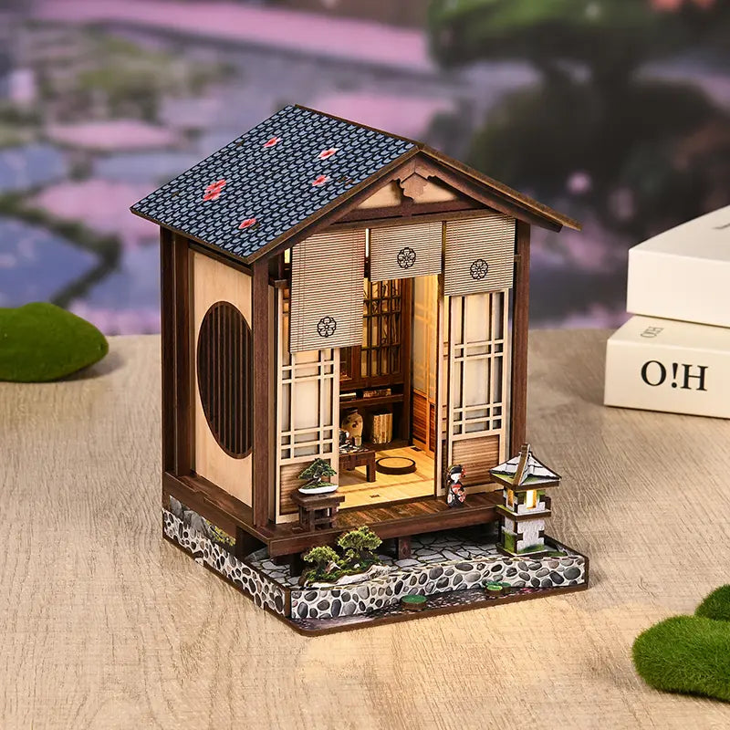【Moss-Lantern Harmony Garden】 miniature Japanese garden glowing between books on a wooden shelf, warm yellow light through shoji door and arched window, stone lantern faintly lit, serene midnight teahouse ambiance