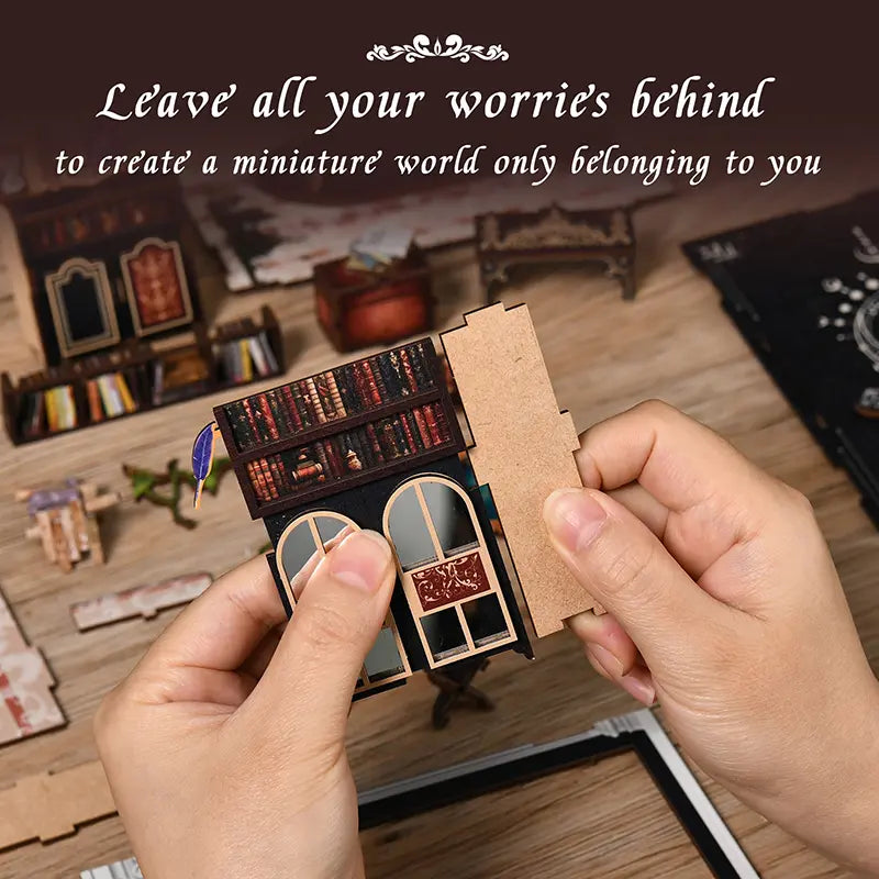 【The Realm of the Magic Book】 Assembly experience close-up: hands connecting wooden parts with arched double doors and printed book spines, enjoying the fun of handcrafting and creating your own miniature world