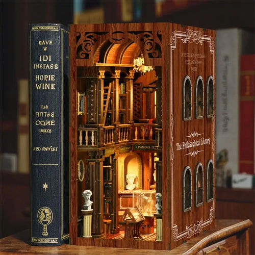 【The Philosophica Library】 DIY book nook fully assembled, showing front classical architectural facade, arched windows, carved door frames, and library name lettering on side panel