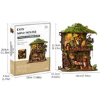 Forest Tea Book Club DIY Miniature Tree House - Assembly in progress showing half-built tree house structure with surrounding components on wooden table
