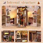 The Alley Waiting for the Cat book nook interior close-up – Japanese shop facades with handcrafted wooden signs, miniature bamboo plant, cat figurines on alley floor, warm LED lighting detail
