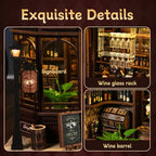 Corner Tavern DIY miniature book nook assembled 45-degree view – Victorian wooden pub with warm amber bar lighting, wine bottles on shelves, hanging wine glasses, wooden barrels and street lamp, handcrafted miniature tavern diorama
