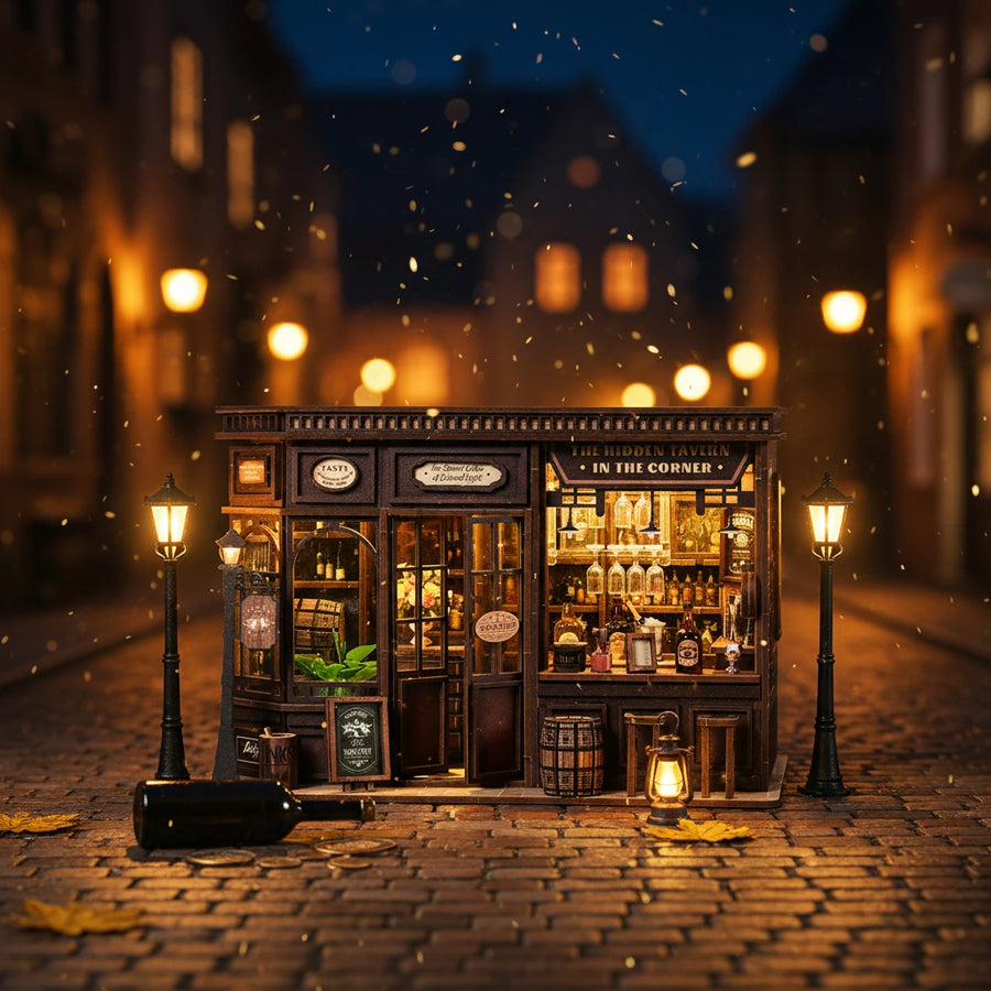 Corner Tavern DIY miniature feature detail – Victorian wooden pub interior with warm amber LED bar lighting, wine bottles and glasses on shelves, bar counter with whisky bottles and ice bucket, cozy British tavern miniature diorama
