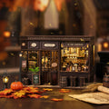 Corner Tavern DIY miniature book nook – Victorian wooden pub with warm amber LED bar lighting, wine bottles on shelves, bar stools and wooden barrels, The Hidden Tavern In The Corner sign, cozy British tavern miniature diorama kit
