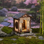 Moss Lantern Harmony Garden DIY book nook miniature – Japanese wooden tea house with dark tiled roof, warm LED interior lighting, moss garden with stone path, bonsai tree and stone lantern, cozy Japanese garden book nook kit
