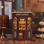 Sweet Chapter DIY Book Nook Kit – dark brown ornate wooden patisserie facade with warm LED display windows, miniature dessert shelves inside, luxurious dark bakery setting